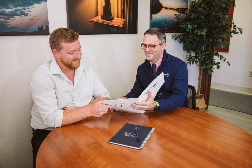 banker showing folder to customer