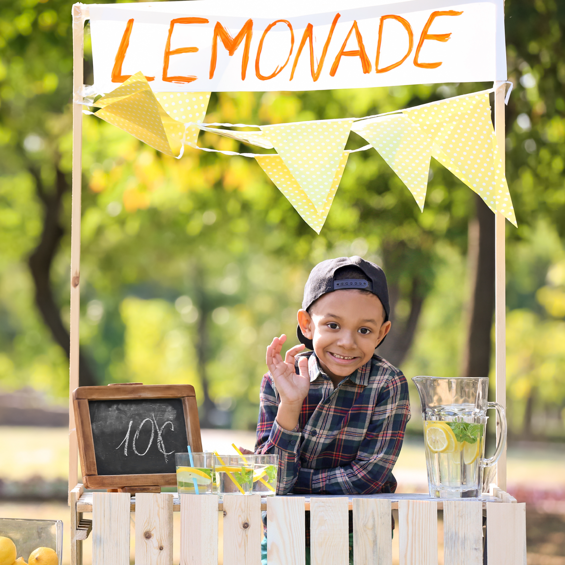 Child with a lemonade stand representing a first job and savings goal